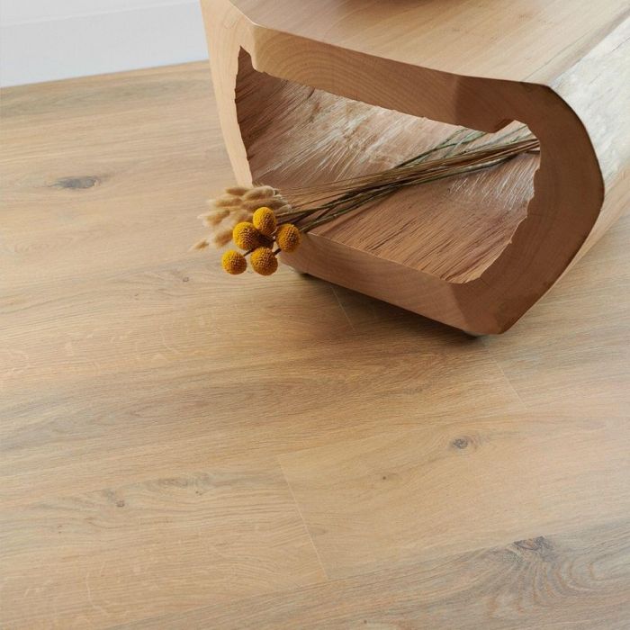 medium oak laminate flooring planks in 8mm thickness with 4v bevelled edges in hallway with flowers gyant natural