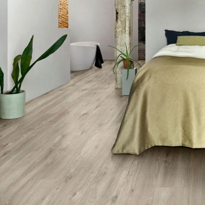 grey wood effect click vinyl flooring in bedrooms with white walls and gold bedding layred sierra oak 58239