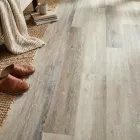 grey and neutral limed wood effect click lvt flooring planks with bevelled edges and underlay attached calico lime wood
