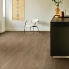 brown oak wood effect click lvt with white walls and black worktop moduleo layred laurel oak 51864