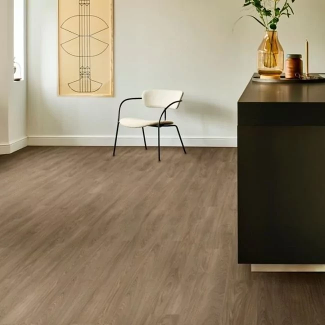 brown oak wood effect click lvt with white walls and black worktop moduleo layred laurel oak 51864