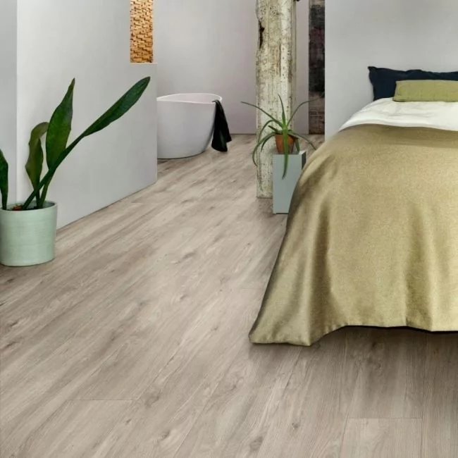 grey wood effect click vinyl flooring in bedrooms with white walls and gold bedding layred sierra oak 58239