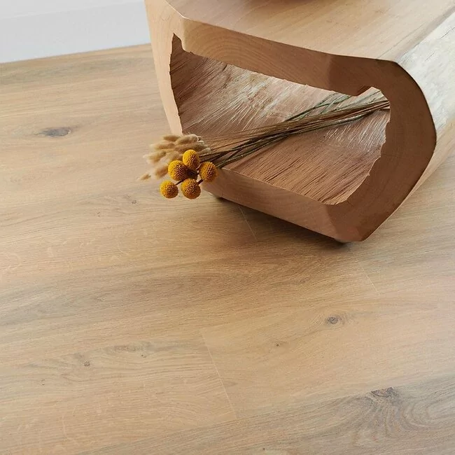 medium oak laminate flooring planks in 8mm thickness with 4v bevelled edges in hallway with flowers gyant natural